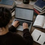 Multilingual writer typing accented letters on a laptop